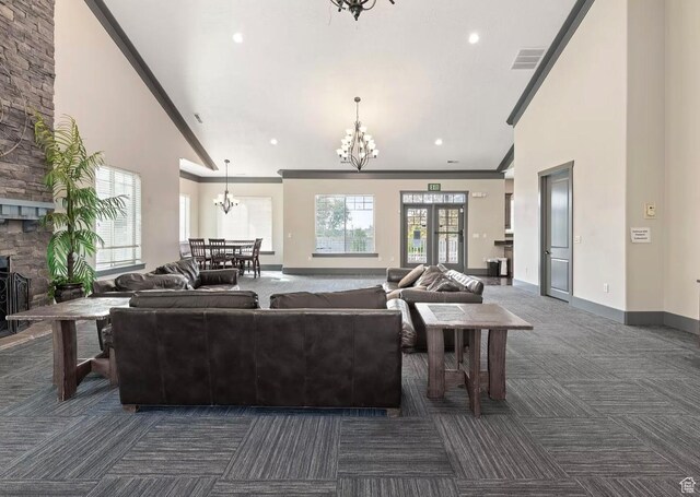 2051 W 1080 N, Provo, UT 84604 - living room featuring a chandelier, dark colored carpet, high vaulted ceiling, ornamental molding, and baseboards