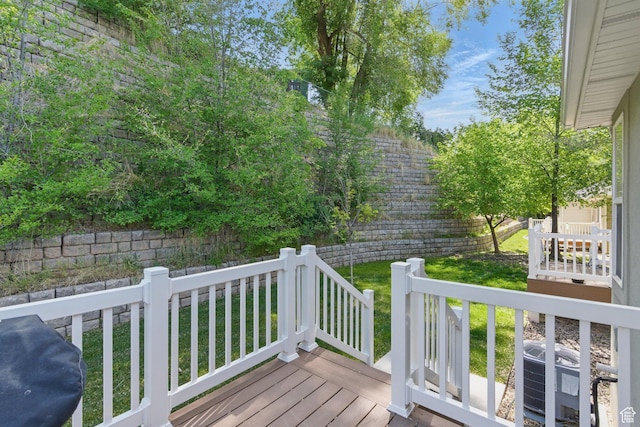 wooden terrace featuring central air condition unit