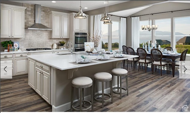 394 W 1225 N Unit 3, Harrisville, UT 84404 - kitchen featuring wall chimney range hood, light countertops, healthy amount of natural light, backsplash, and vaulted ceiling