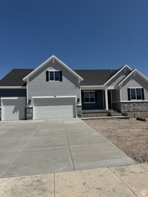 394 W 1225 N Unit 3, Harrisville, UT 84404 - craftsman house with stone siding, concrete driveway, an attached garage, and covered porch