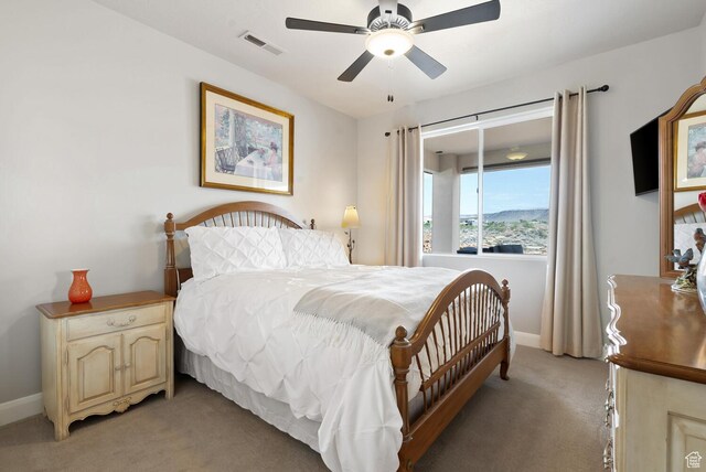 921 N Camino Pico N, Washington, UT 84780 - bedroom featuring light carpet, baseboards, and a ceiling fan