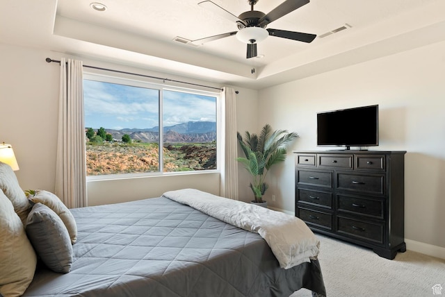 921 N Camino Pico N, Washington, UT 84780 - bedroom with light colored carpet, a tray ceiling, baseboards, and a ceiling fan