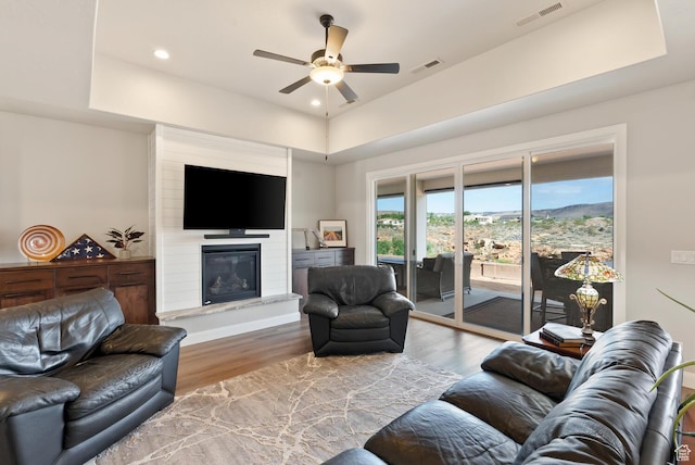 921 N Camino Pico N, Washington, UT 84780 - living area featuring ceiling fan, wood finished floors, a fireplace, recessed lighting, and a raised ceiling