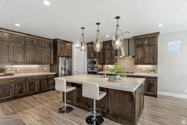 750 W 1860 N, Washington, UT 84780 - kitchen featuring wall chimney range hood, stainless steel appliances, backsplash, baseboards, and recessed lighting