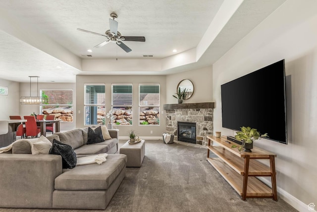 750 W 1860 N, Washington, UT 84780 - living area with baseboards, ceiling fan, carpet floors, a fireplace, and a textured ceiling