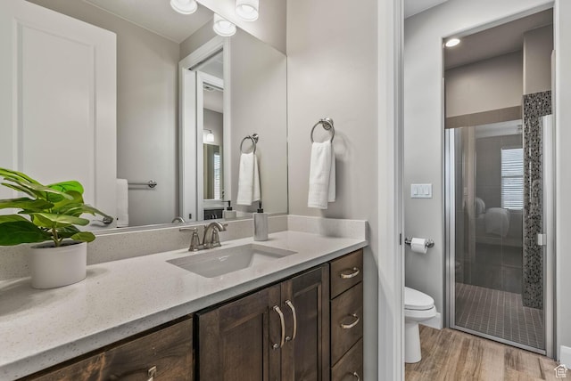 750 W 1860 N, Washington, UT 84780 - bathroom featuring a shower stall, toilet, vanity, and wood finished floors