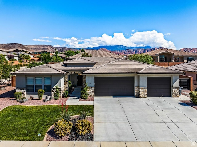 750 W 1860 N, Washington, UT 84780 - prairie-style home featuring stone siding, an attached garage, stucco siding, concrete driveway, and a tiled roof