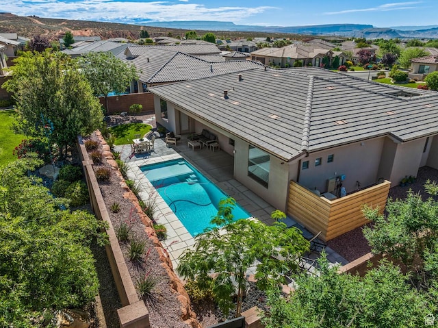 750 W 1860 N, Washington, UT 84780 - rear view of property with a tiled roof, stucco siding, a patio, and a residential view