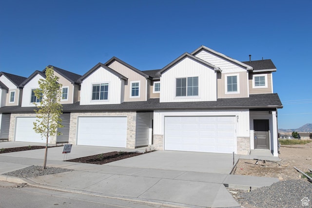 561 N 300 W, Smithfield, UT 84335 - multi unit property featuring a garage, driveway, and stone siding