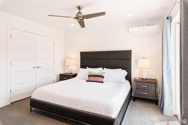 bedroom with a wall mounted air conditioner, light carpet, a closet, recessed lighting, and ceiling fan