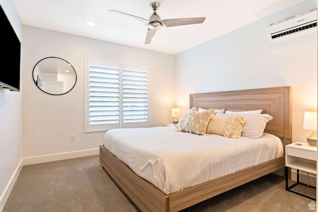 carpeted bedroom featuring a wall mounted AC, baseboards, a ceiling fan, and recessed lighting