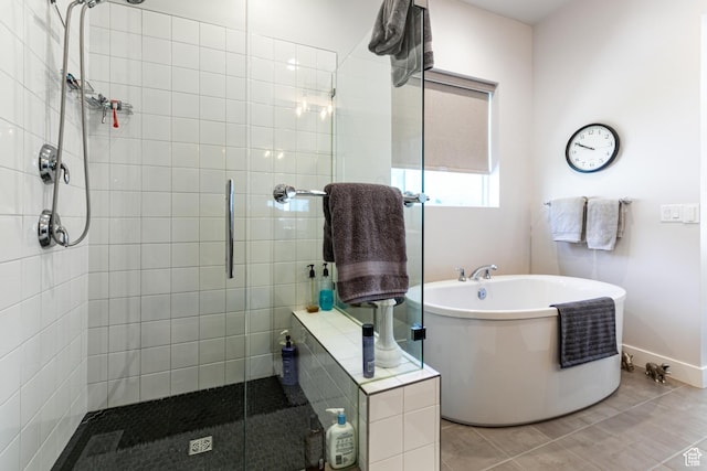 5502 N Valley Rd W, Lehi, UT 84043 - bathroom with tiled shower, a soaking tub, and baseboards