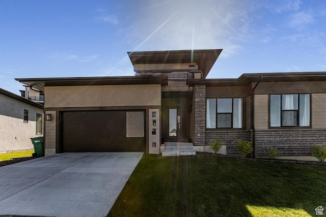 5502 N Valley Rd W, Lehi, UT 84043 - view of front of property with a garage, concrete driveway, a front lawn, and brick siding