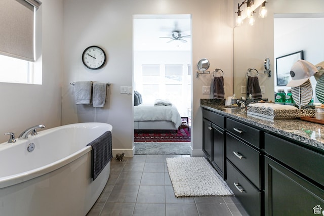 5502 N Valley Rd W, Lehi, UT 84043 - bathroom with ceiling fan, a freestanding bath, double vanity, tile patterned floors, and ensuite bathroom