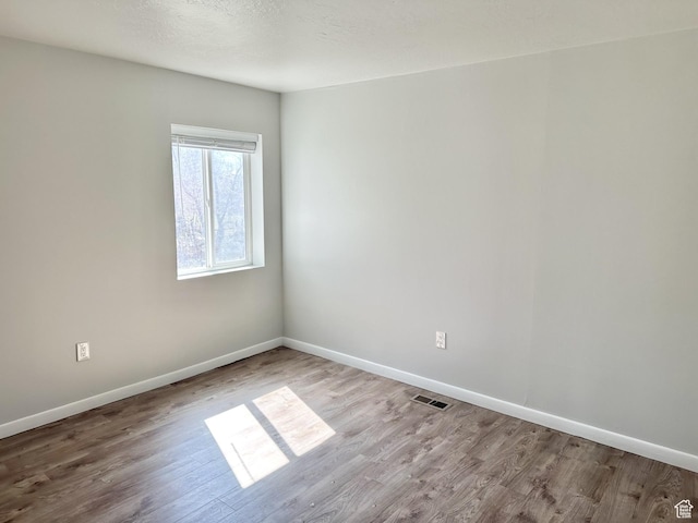 600 S Main St, Kaysville, UT 84037 - empty room with wood finished floors and baseboards