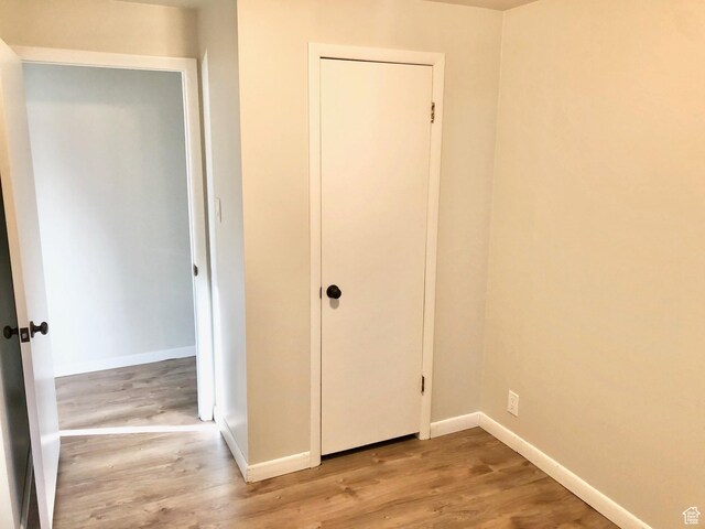 600 S Main St, Kaysville, UT 84037 - unfurnished bedroom with wood finished floors, baseboards, and a closet