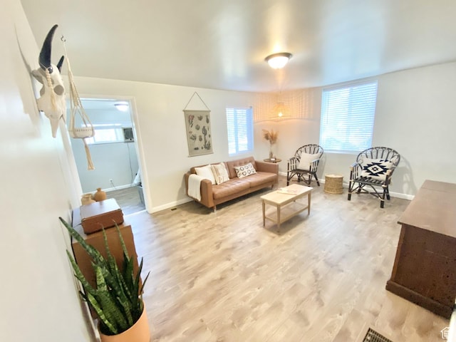 600 S Main St, Kaysville, UT 84037 - living room featuring light wood finished floors, plenty of natural light, and baseboards