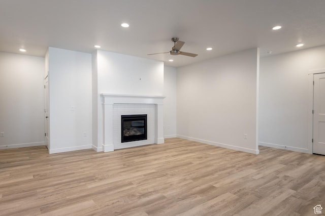 3786 S 4250 W Unit 427, West Haven, UT 84401 - unfurnished living room featuring a ceiling fan, recessed lighting, light wood finished floors, a fireplace, and baseboards