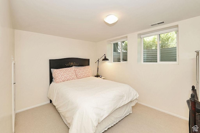 carpeted bedroom with baseboards