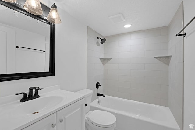bathroom with toilet, recessed lighting, vanity, bathtub / shower combination, and a textured ceiling