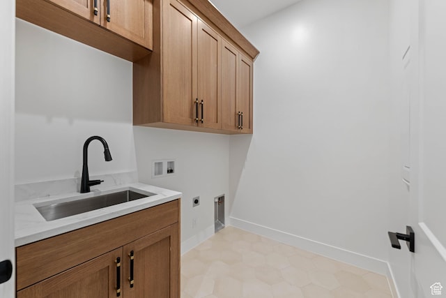washroom featuring hookup for an electric dryer, washer hookup, cabinet space, and baseboards