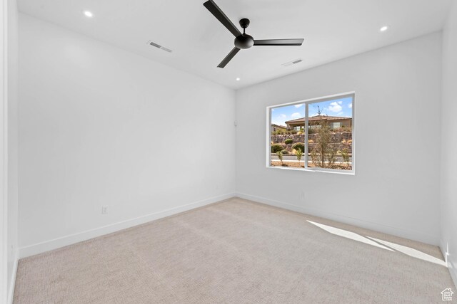 spare room with carpet floors, baseboards, a ceiling fan, and recessed lighting