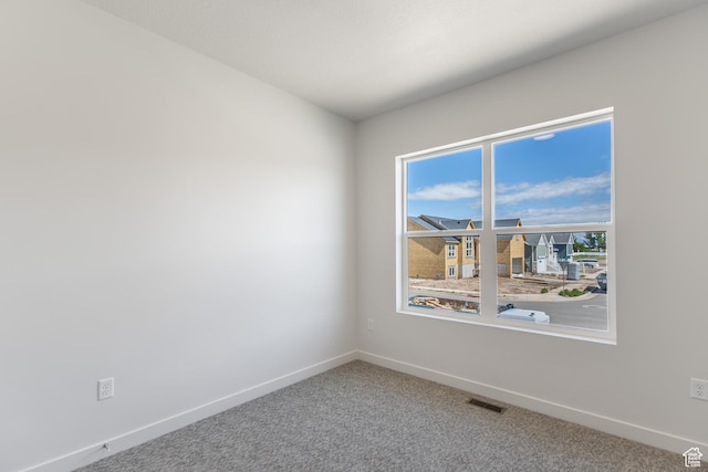 3573 W 725 S Unit 106, West Weber, UT 84401 - spare room with baseboards and carpet