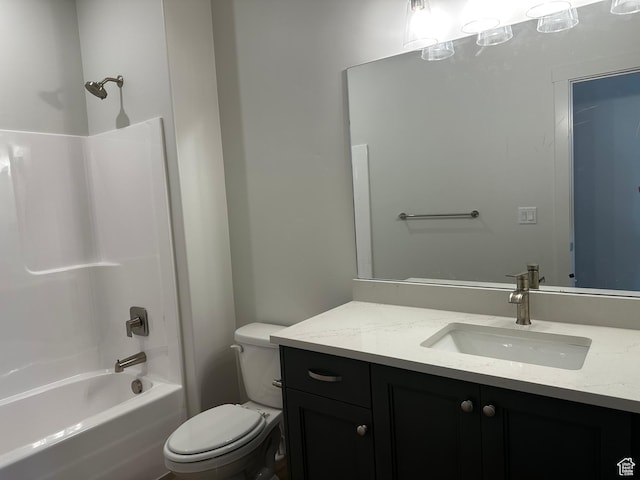 full bath with toilet, vanity, and  shower combination
