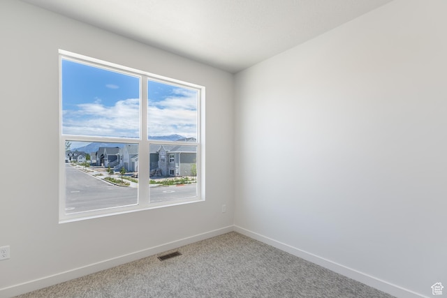 3573 W 725 S Unit 106, West Weber, UT 84401 - spare room featuring carpet floors and healthy amount of natural light