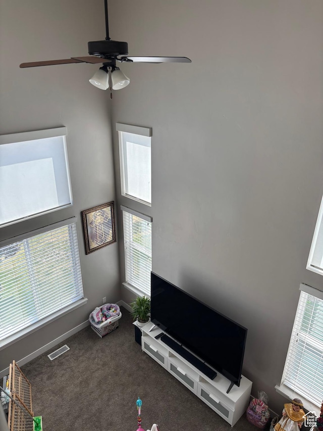 4317 W Quiet Shade Dr, Herriman, UT 84096 - unfurnished living room with ceiling fan, carpet, and baseboards