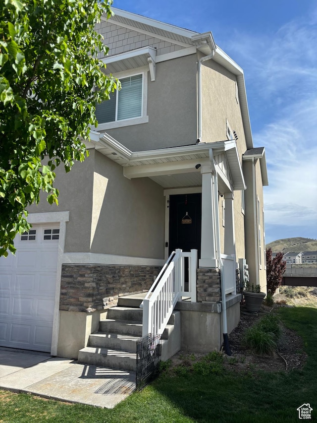 4317 W Quiet Shade Dr, Herriman, UT 84096 - view of front of property featuring stone siding, stucco siding, and a garage