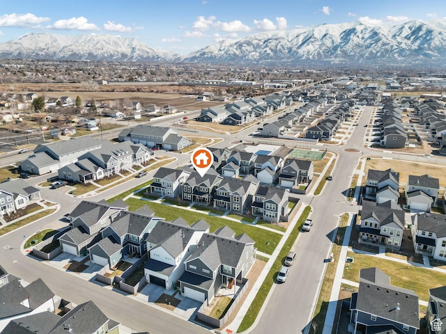 aerial view of residential area featuring a mountain backdrop