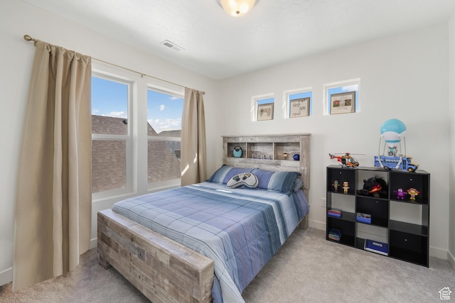 bedroom with carpet flooring and baseboards