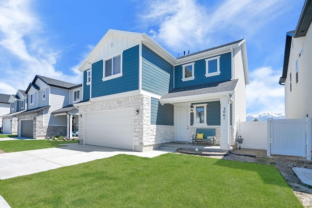 view of front facade with stone siding, a garage, concrete driveway, a porch, and board and batten siding