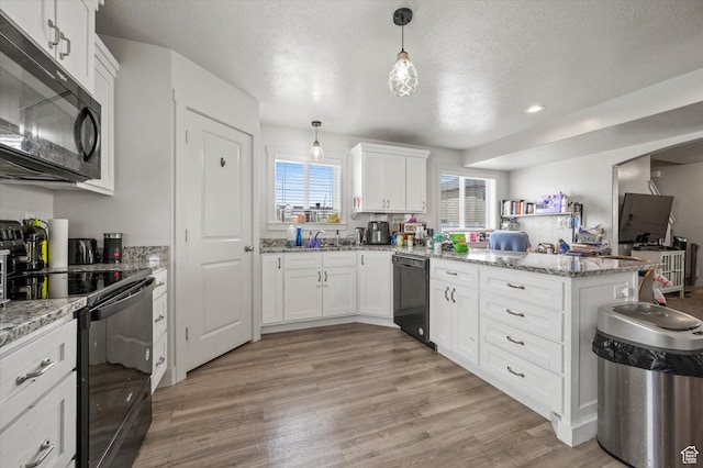 2460 W 450 N Unit 7, Tremonton, UT 84337 - kitchen featuring black appliances, a peninsula, light wood-style floors, white cabinetry, and recessed lighting