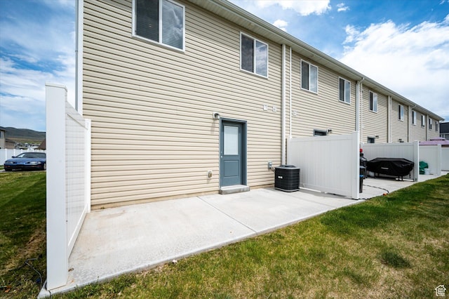 2460 W 450 N Unit 7, Tremonton, UT 84337 - back of property featuring a patio area and central air condition unit