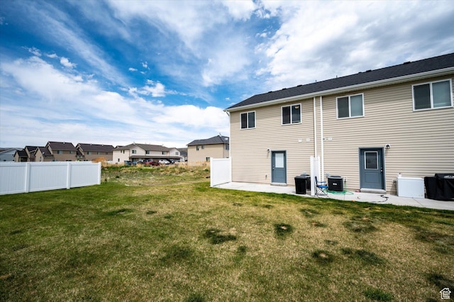 2460 W 450 N Unit 7, Tremonton, UT 84337 - back of house featuring a patio area, a residential view, and cooling unit
