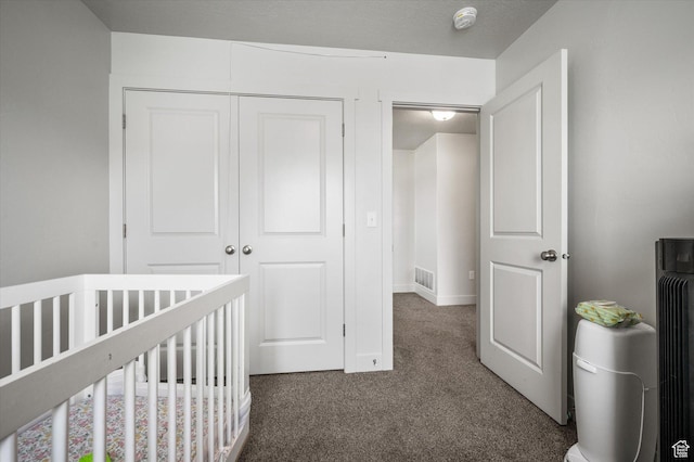 2460 W 450 N Unit 7, Tremonton, UT 84337 - bedroom featuring carpet floors, a closet, a crib, and baseboards