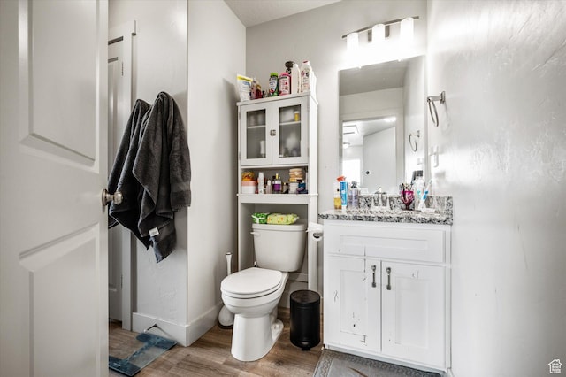 2460 W 450 N Unit 7, Tremonton, UT 84337 - half bath with wood finished floors, toilet, and vanity