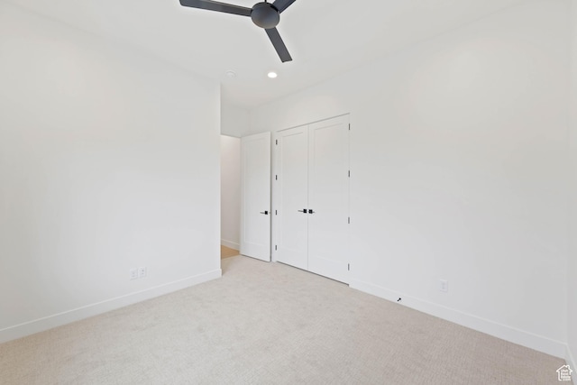 unfurnished bedroom with baseboards, carpet floors, recessed lighting, a closet, and ceiling fan