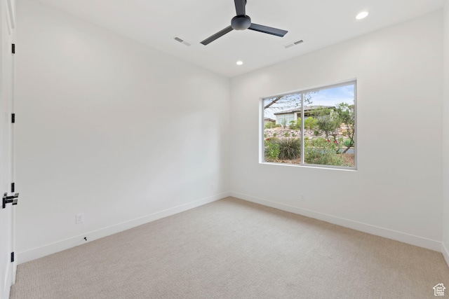 unfurnished room featuring light carpet, a ceiling fan, recessed lighting, and baseboards