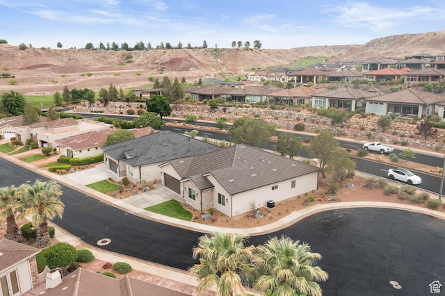 aerial perspective of suburban area featuring a mountain backdrop
