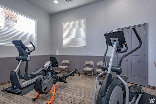 exercise area with carpet floors and recessed lighting