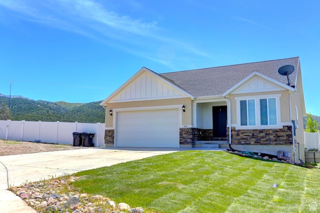198 E 1430 S, Nephi, UT 84648 - view of front of house featuring stone siding, driveway, a garage, a mountain view, and a shingled roof