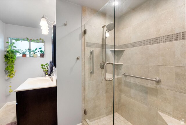 804 E 100 N, Logan, UT 84321 - bathroom with a shower stall, vanity, tile patterned floors, and baseboards