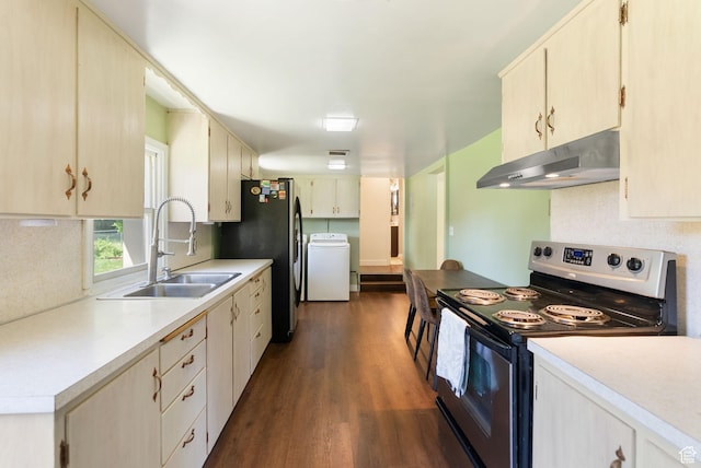 804 E 100 N, Logan, UT 84321 - kitchen featuring under cabinet range hood, stainless steel appliances, a sink, washer / dryer, and dark wood-type flooring
