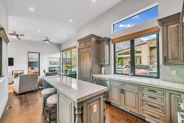 1203 Canyon Springs Rd, Springdale, UT 84767 - kitchen featuring a sink, dishwasher, open floor plan, backsplash, and a kitchen island