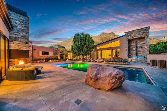 1203 Canyon Springs Rd, Springdale, UT 84767 - view of pool featuring a patio, an outdoor living space with a fireplace, and a mountain view