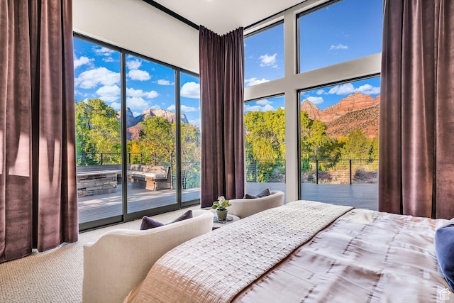 1203 Canyon Springs Rd, Springdale, UT 84767 - bedroom featuring access to exterior, carpet flooring, multiple windows, and a mountain view