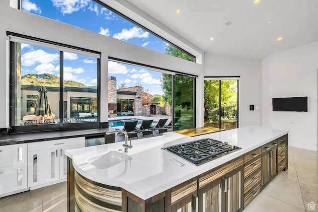 1203 Canyon Springs Rd, Springdale, UT 84767 - kitchen with stainless steel gas stovetop, light tile patterned floors, a sink, recessed lighting, and open floor plan